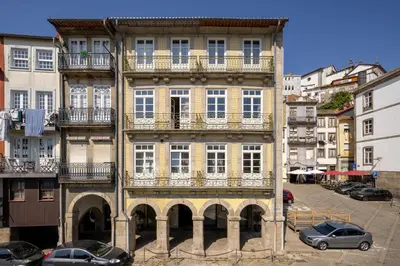 a tall building with balconies on the side of it at Porta Nobre Boutique Hotel by Aspasios in Porto