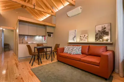 a living room with a couch and a table at BRA com Apartments Oporto House 68 in Porto