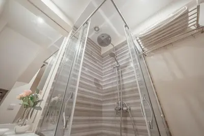 a shower with a glass door in a bathroom at River Eyes at Porto apartments in Porto