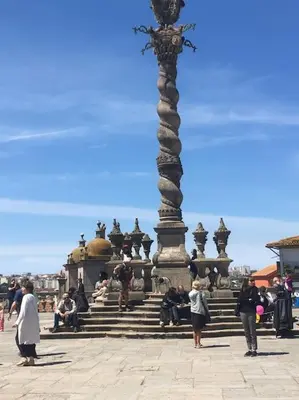 a group of people standing in front of a statue at Dom Luis apartment in Porto