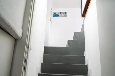 a staircase in a building with a sign on it at Ribeira Loft in Porto