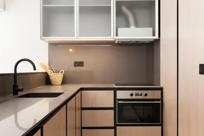 a kitchen with a sink and a stove at VIVA Miragaia Downtown in Porto
