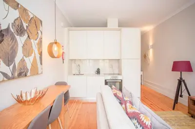 a living room with a couch and a table at Liiiving in Porto - Ribeira Secret Apartment in Porto