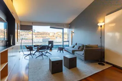 a living room with a couch and a table at MY DOURO VIEW Luxury Apartment River Front in Vila Nova de Gaia
