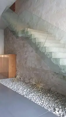 a room with a glass ceiling with rocks on the floor at MY DOURO VIEW Luxury Apartment River Front in Vila Nova de Gaia