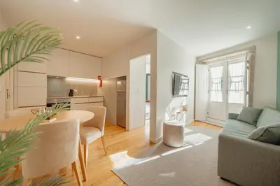 a living room with a couch and a table at River Eyes Apartments in Porto
