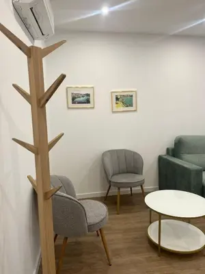 a waiting room with chairs and a table at ORM- Flores Apartment in Porto