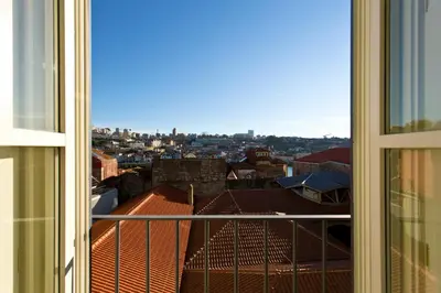 a view of a city from a window at BOUTIQUE Rentals-Kinga’s Ribeira River great views in Porto