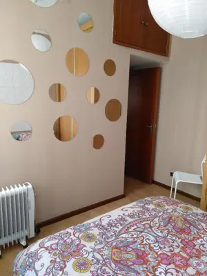 a bedroom with circles on the wall at Oportobestview-Douro in Porto