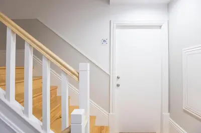 a white door leading up to a staircase at Trendy Vintage Downtown by LovelyStay in Porto