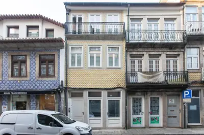 a white van parked in front of a row of buildings at Trendy Vintage Downtown by LovelyStay in Porto