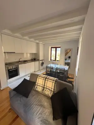 a living room with a couch and a table at OPORTO WINE LOFTS in Vila Nova de Gaia
