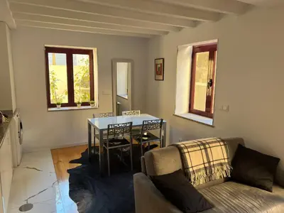 a living room with a table and a couch at OPORTO WINE LOFTS in Vila Nova de Gaia