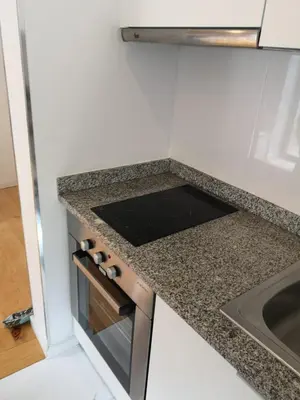 a kitchen with a counter top and a sink at OPORTO WINE LOFTS in Vila Nova de Gaia