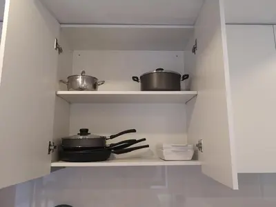 two pots and pans on a shelf in a kitchen at OPORTO WINE LOFTS in Vila Nova de Gaia
