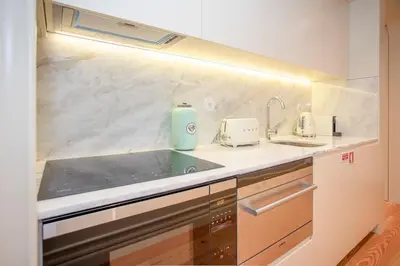 a kitchen with a sink and a counter top at Liiiving in Porto - Cedofeita Charming Apartment in Porto