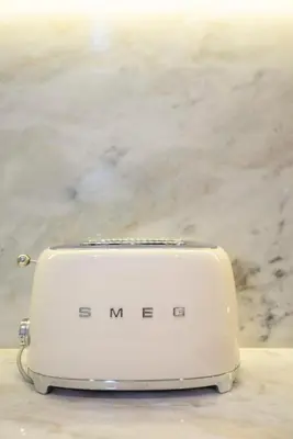 a white toaster sitting on top of a counter at Liiiving in Porto - Cedofeita Charming Apartment in Porto