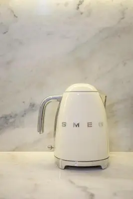 a white toaster sitting on top of a counter at Liiiving in Porto - Cedofeita Charming Apartment in Porto