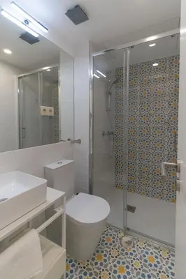 a small closet with white doors and a hallway at Portucale Guest House- Self check-in in Porto