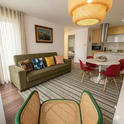 a living room with a couch and a table at OportoCityView - Ceuta Aliados in Porto