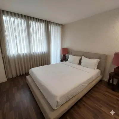 a small bedroom with two beds and a window at OportoCityView - Ceuta Aliados in Porto
