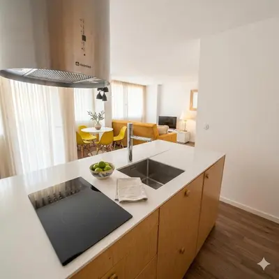 a kitchen with a sink and a counter top at OportoCityView - Ceuta Aliados in Porto