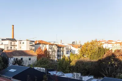 a view of a city with buildings and trees at Bombarda Apartments by LovelyStay in Porto