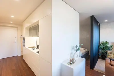an open kitchen and living room in a house at Bombarda Apartments by LovelyStay in Porto