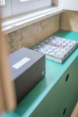 a counter with a box of coke bottles on it at 62 Design House in Porto