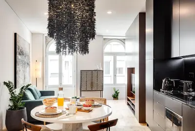 a living room with a table with food on it at Conceição Premium Downtown Apartment by DA'HOME in Porto