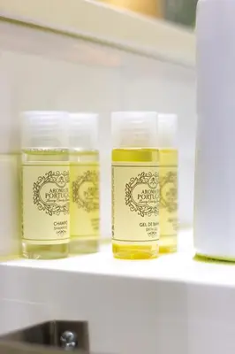 three jars of honey on a shelf in a refrigerator at Riverside 2 Bedroom Apartment by DA'HOME in Porto