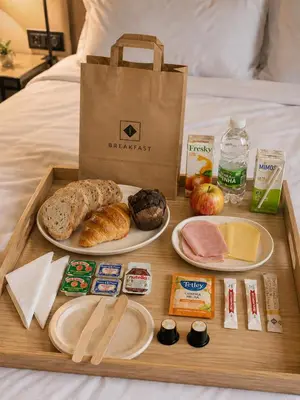 a bedroom with a large bed and a large window at MyStay Porto São Bento in Porto