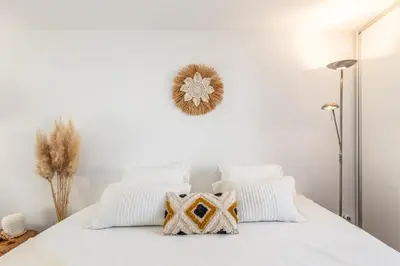 a living room with a white couch and a table at Riva House in Porto