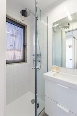 a bathroom with a shower and a sink at Riva House in Porto