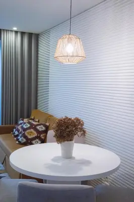 a table in a living room with a potted plant at Almada Downtown Apartment by DA'HOME in Porto