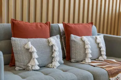 a blue couch with pillows on top of it at Alvaro´s Loft Downtown in Porto