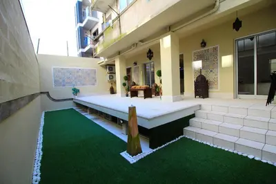a building with a bench and a green rug at HEART OF THE CITY ! in Porto