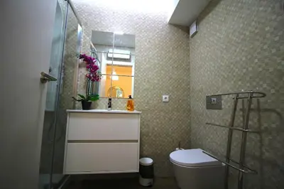 a bathroom with a shower and a toilet and a sink at HEART OF THE CITY 5 ! in Porto