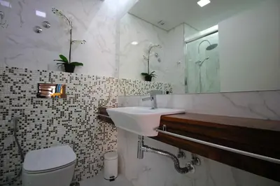 a bathroom with a sink and a toilet and a mirror at HEART OF THE CITY 7 ! in Vila Nova de Gaia