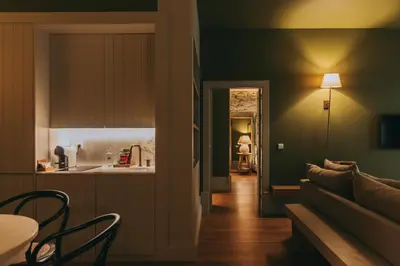 a living room with a couch and a table at Torel Saboaria in Porto