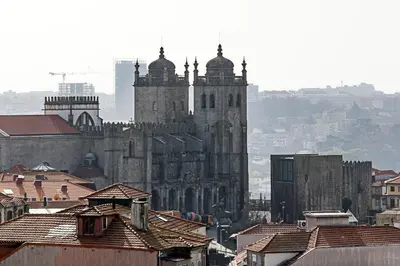 an old building with two towers in a city at Downtown Studio w/ Gorgeous Views by LovelyStay in Porto