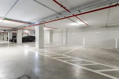 an empty parking garage with a car parked in it at OPorto Design Flat in Porto