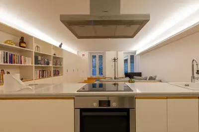 a kitchen with a sink and a counter top at ORM Torrinha Apartment in Porto