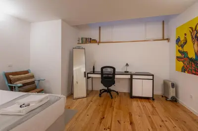 a room with a desk and a chair in it at ORM Torrinha Apartment in Porto