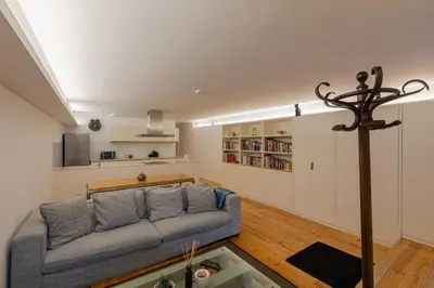 a living room with a couch and a table at ORM Torrinha Apartment in Porto