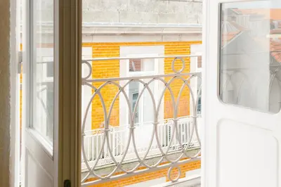 an open window with a view of a building at VIVA Three Magi Residence in Porto