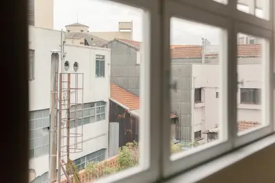 an open window with a view of buildings at VIVA Three Magi Residence in Porto