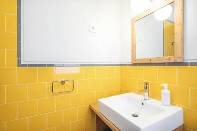 a bathroom with a sink and a mirror at VIVA Three Magi Residence in Porto