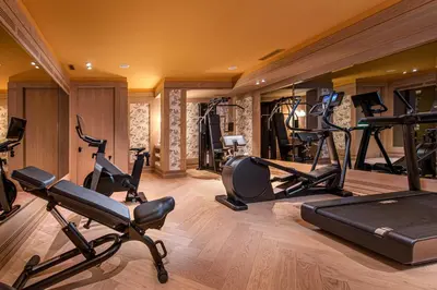 a gym with several exercise bikes and treadmills at The Editory Boulevard Aliados Hotel - Preferred Hotels in Porto