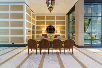 a dining room with a table and four chairs at The Editory Boulevard Aliados Hotel - Preferred Hotels in Porto